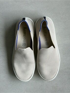 Rothy’s Original Slip-On Canvas Sneakers in Cream with Blue Trim